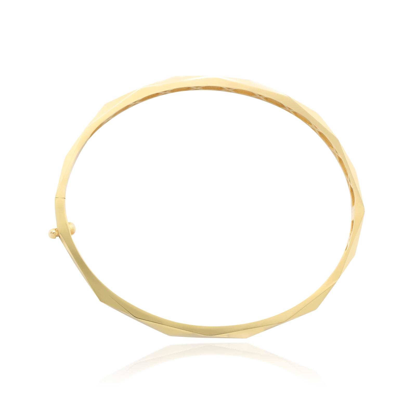 Pulsera rígida esclava realizada en oro amarillo de 18 quilates facetada en rombos.