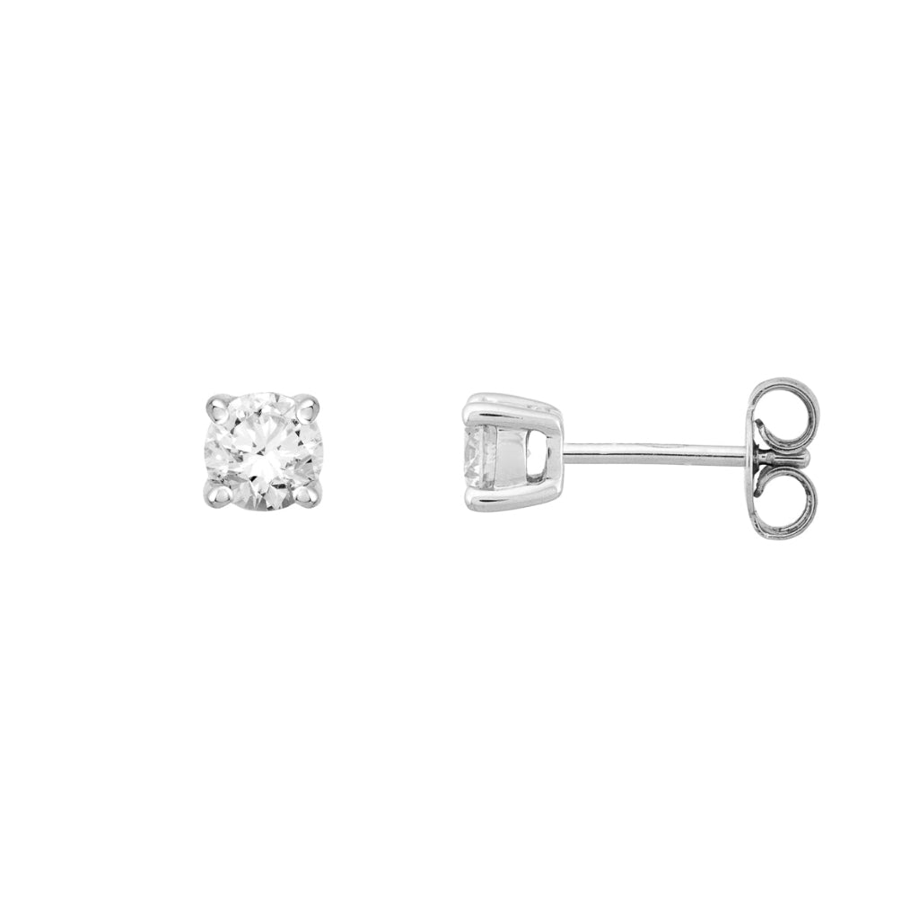 Pendientes en oro blanco de 18 quilates con un solitario de diamante engarzado en cuatro garras redondas. Joyería Pamplona.