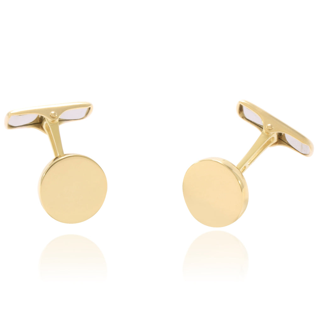 Gemelos para camisa planos circulares realizados en oro amarillo de 18 quilates.