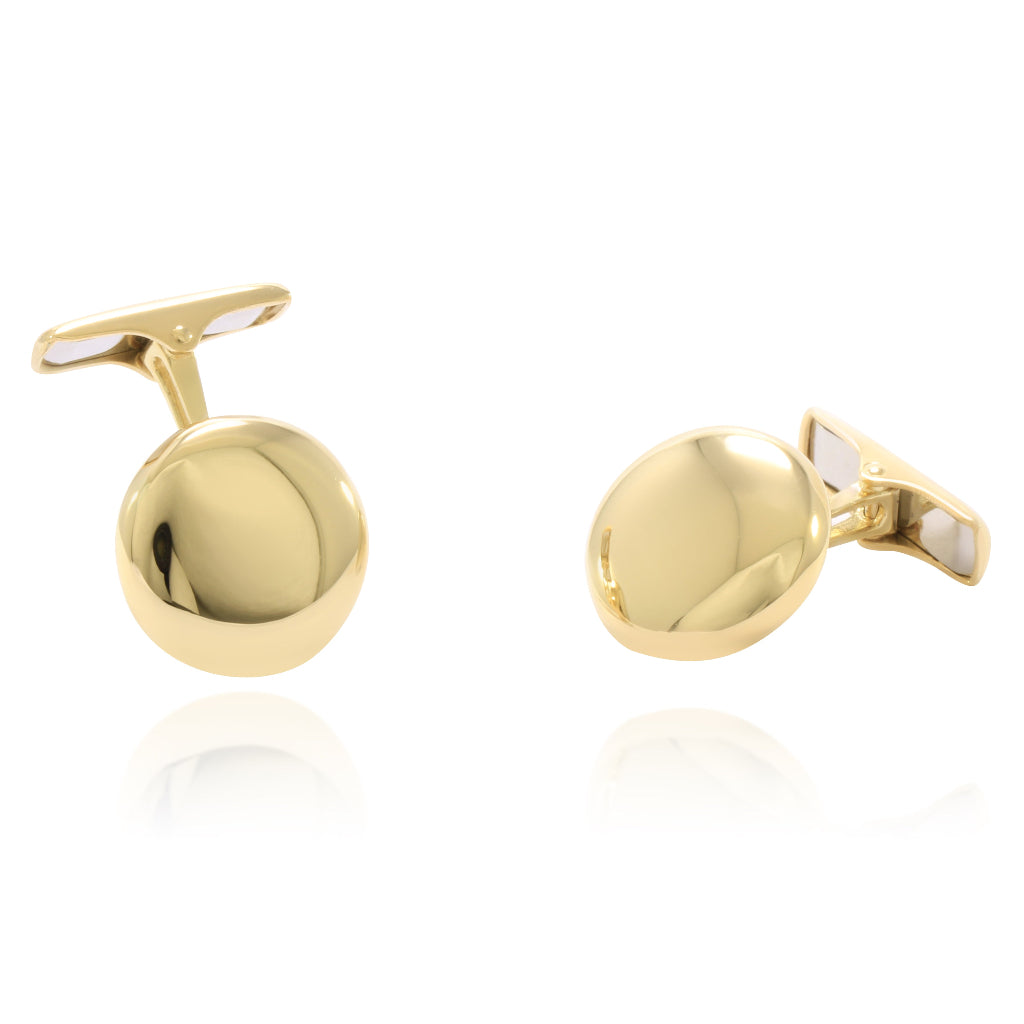 Gemelos para camisa redondos realizados en oro amarillo de 18 quilates.