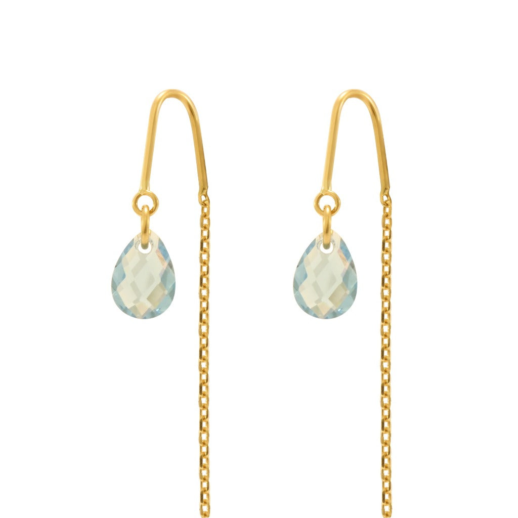Pendientes largos de oro amarillo 18 quilates con un motivo principal de circonita azul. Colección MONTREY, la marca de la casa.