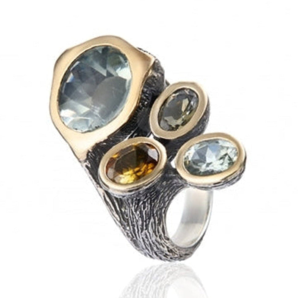 Anillo realizado en plata de primera ley (925) y oro 9 de quilates, amatistas verdes y turmalinas multicolor. Styliano Navarra