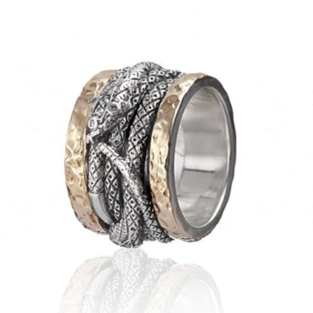 Anillo realizado en plata de primera ley (925) y oro 9 de quilates, circonitas blancas.