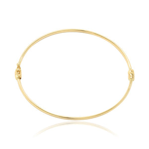 Pulsera rígida esclava media caña plana en oro amarillo de 18 quilates