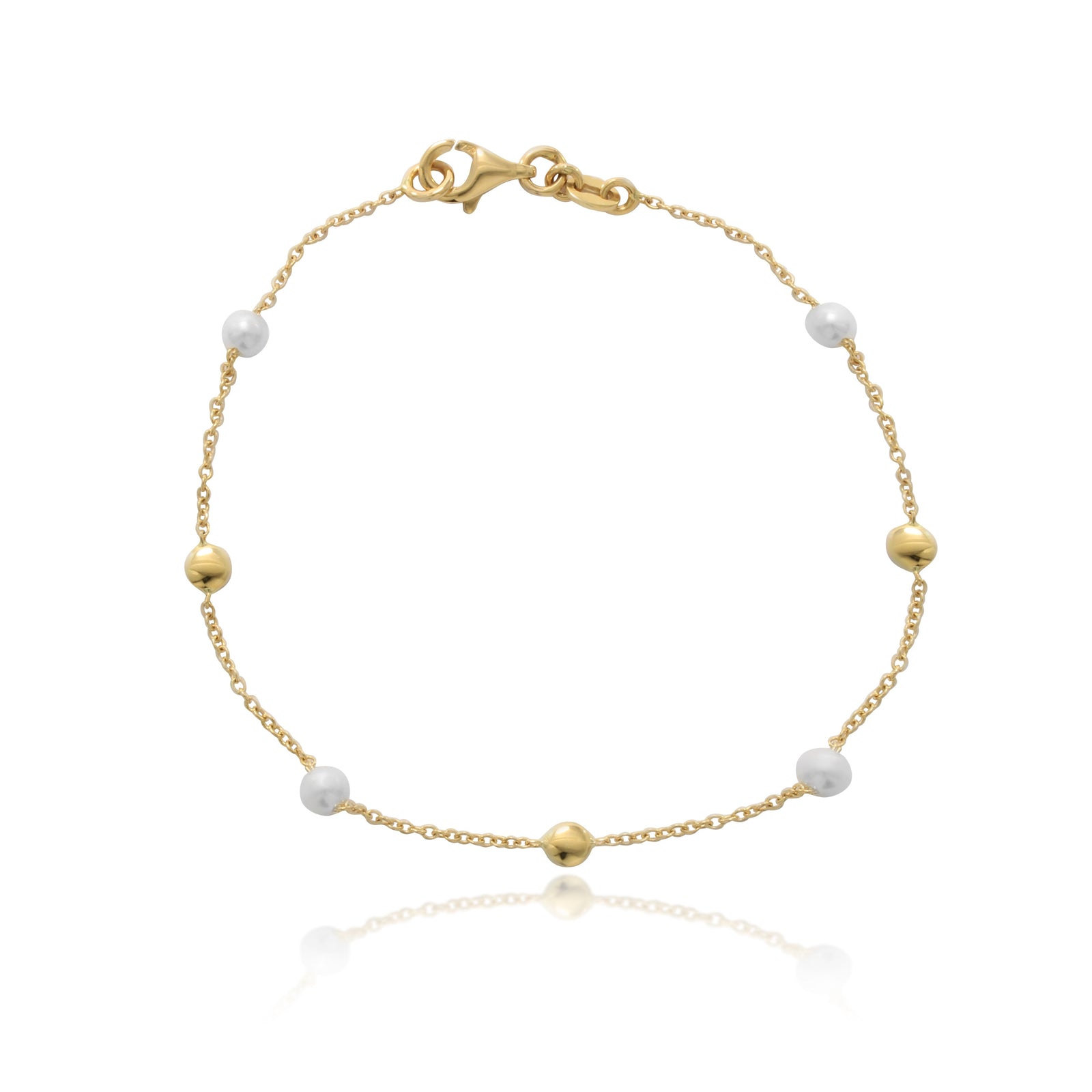 Pulsera realizada en oro amarillo de 18 quilates con motivos circulares lisos y perlas cultivadas