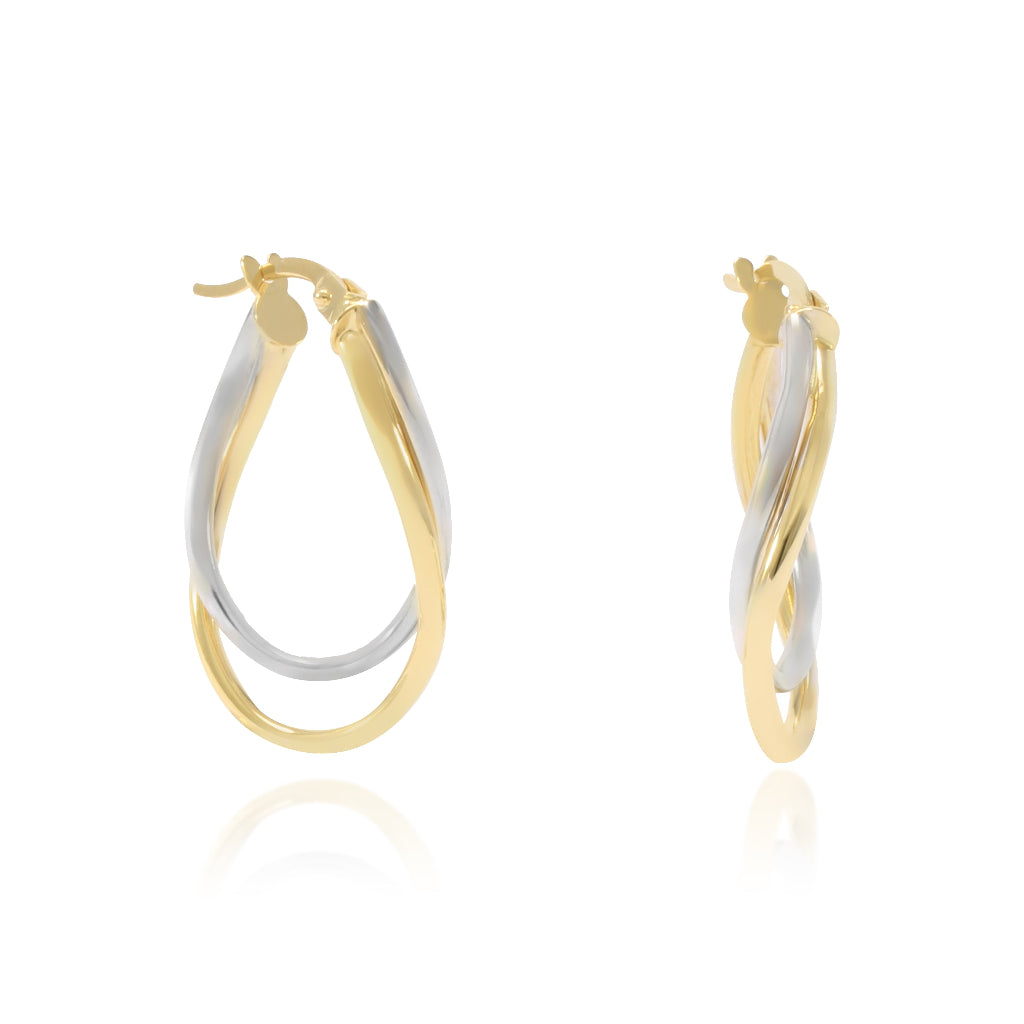 Pendientes de aro en oro blanco y amarillo de 18 quilates. El aro es doble con forma ovalada irregular.
