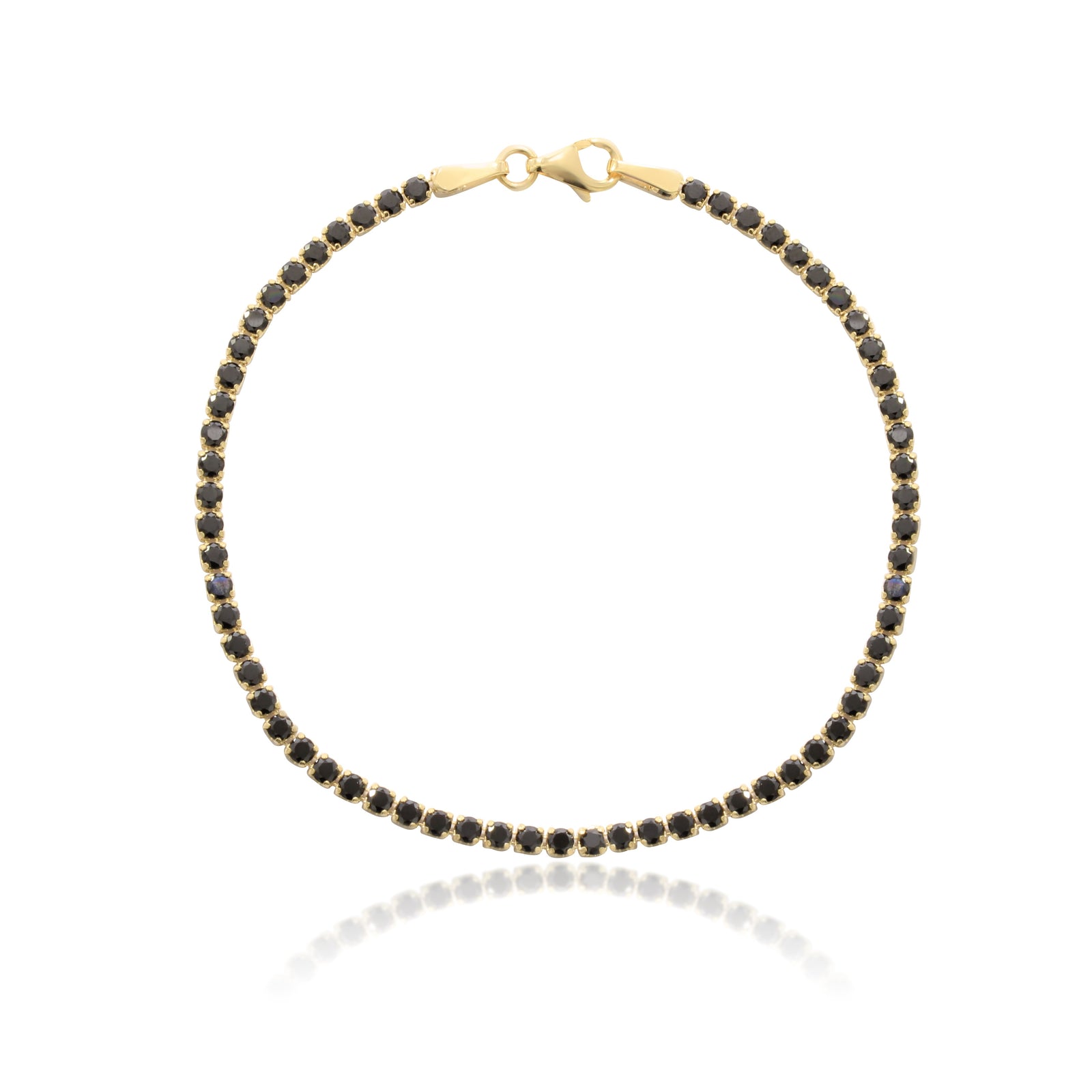 Pulsera realizada en oro amarillo de 18 quilates con circonitas negras.