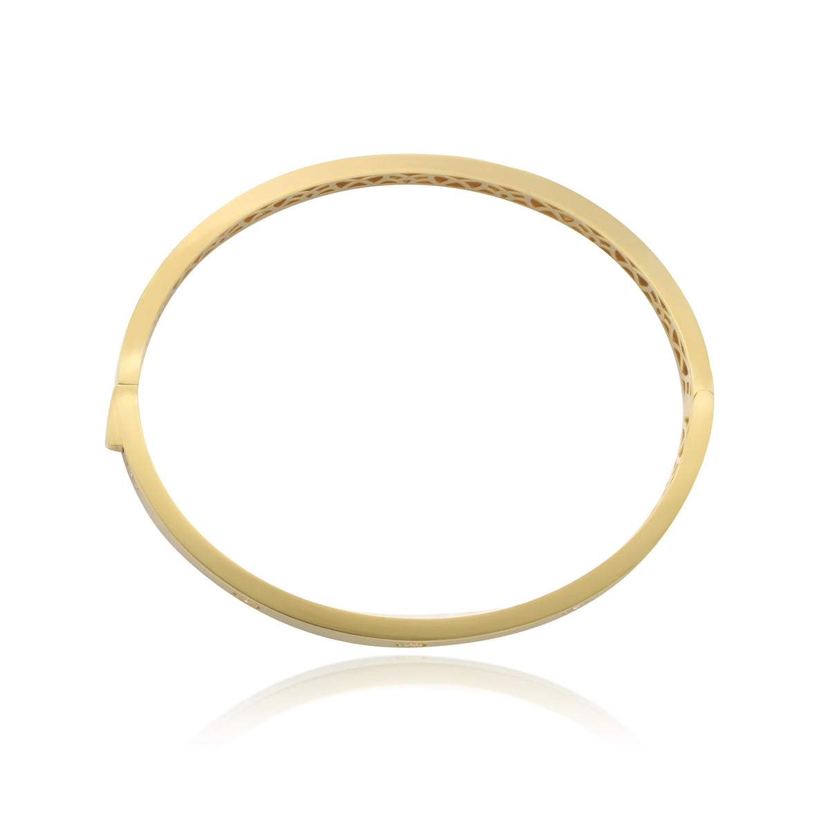 Pulsera rígida esclava realizada en oro amarillo de 18 quilates con circonitas.