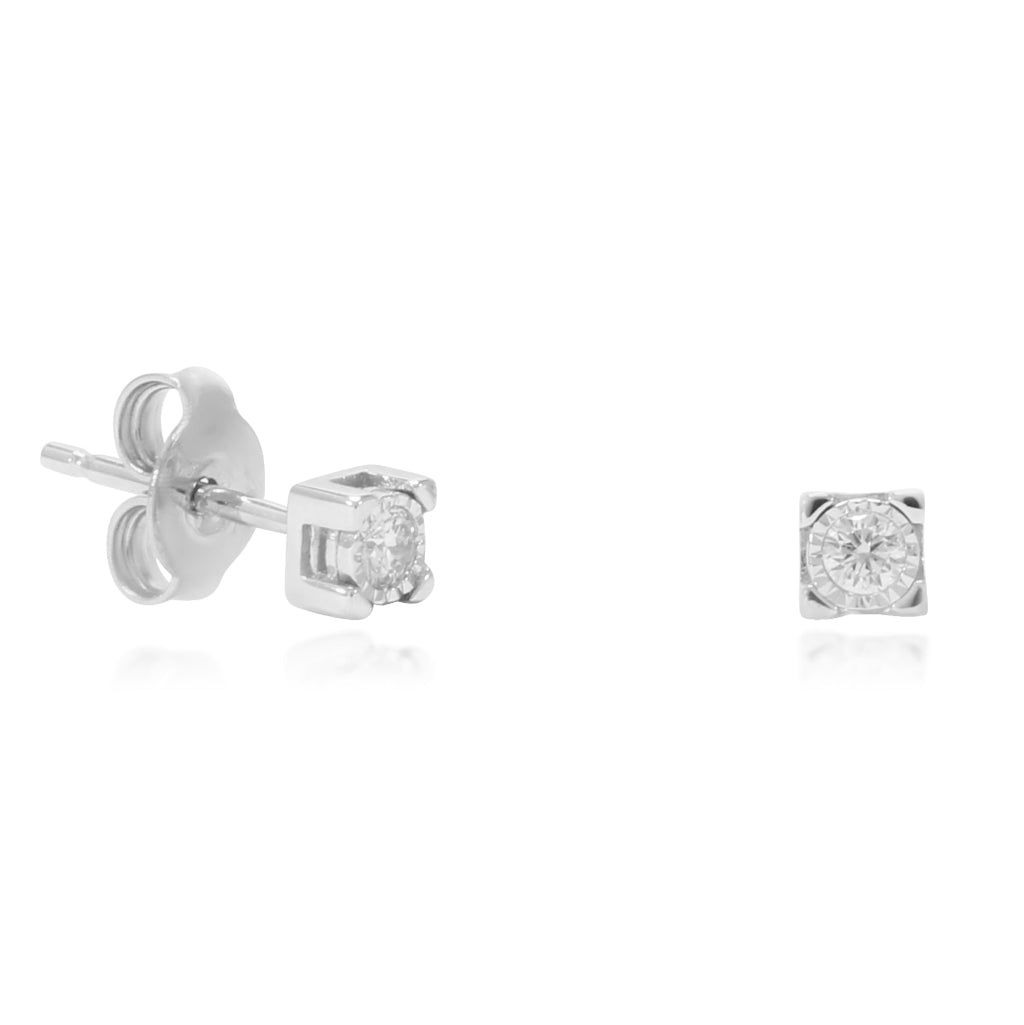 Pendientes realizados en oro blanco de 18 quilates con 2 diamantes solitarios talla brillante. Joyería Pamplona