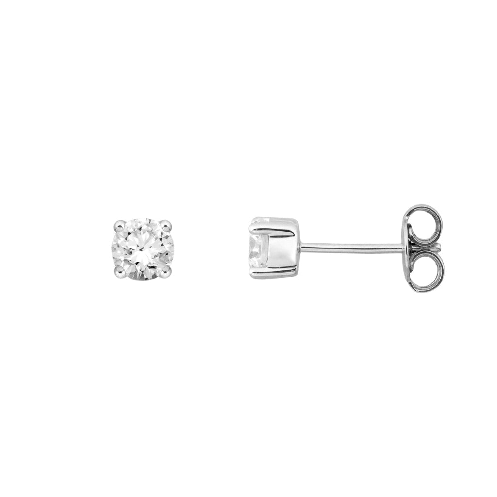 Pendientes en oro blanco de 18 quilates con un solitario de diamante engarzado en cuatro garras redondas. Joyería Pamplona.