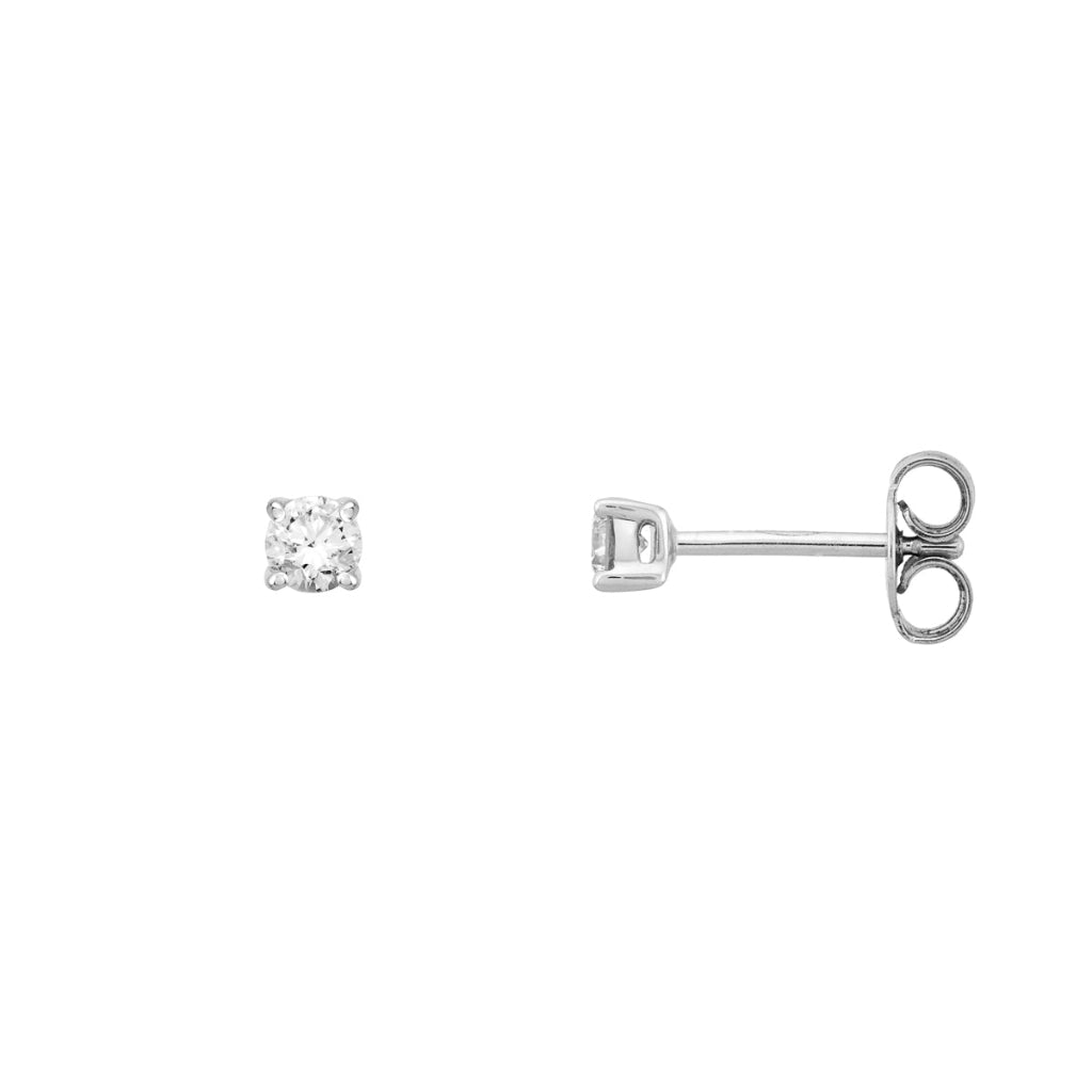Pendientes en oro blanco de 18 quilates con un solitario de diamante engarzado en cuatro garras redondas. Joyería Pamplona.