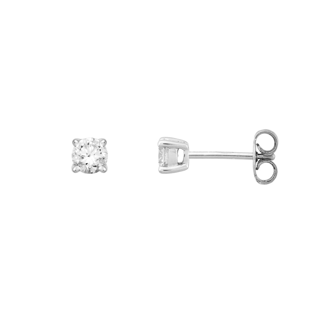 Pendientes en oro blanco de 18 quilates con un solitario de diamante engarzado en cuatro garras redondas. Joyería Pamplona.