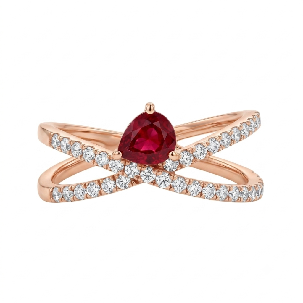 Sortija realizada en oro rosa de 18 K, con un brazo doble cruzado, pavonado con diamantes talla brillante y con un rubí en talla pera engastado en garras.