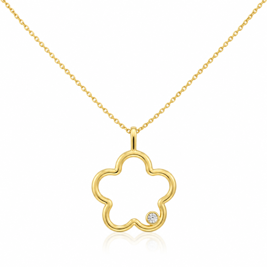Gargantilla realizada en oro amarillo de 18 quilates con diseño de flor calada y una circonita en solitario engastada en uno de sus pétalos. El colgante mide 2,2cm y la cadena mide 44cm.