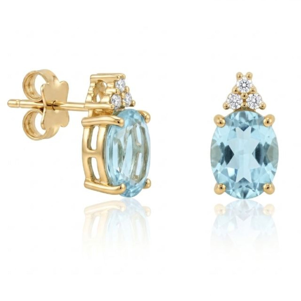 Pendientes de oro amarillo de 18 quilates con aguamarina ovalada y circonitas.
