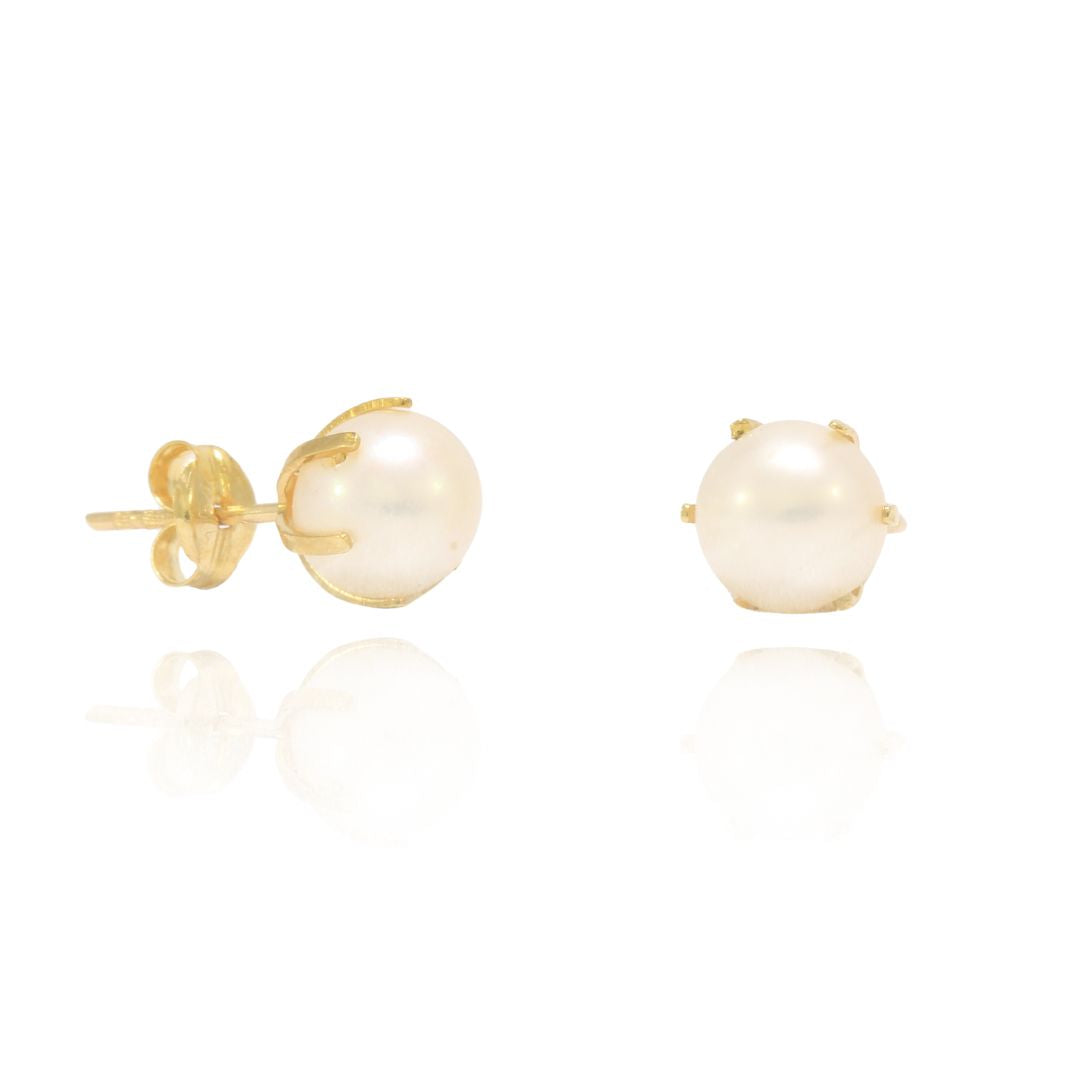 pendientes de niña realizados en oro amarillo 18k con seis garras