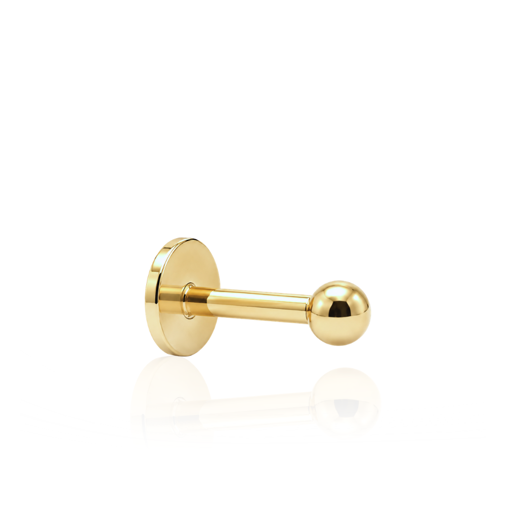 Piercing realizado en oro de 18 quilates. 