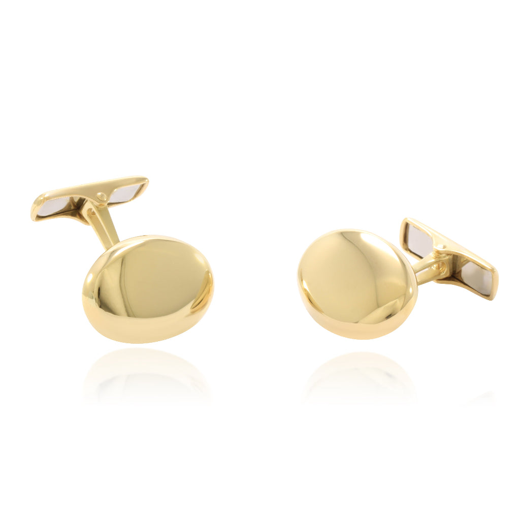 Gemelos para camisa ovalados realizados en oro amarillo de 18 quilates.