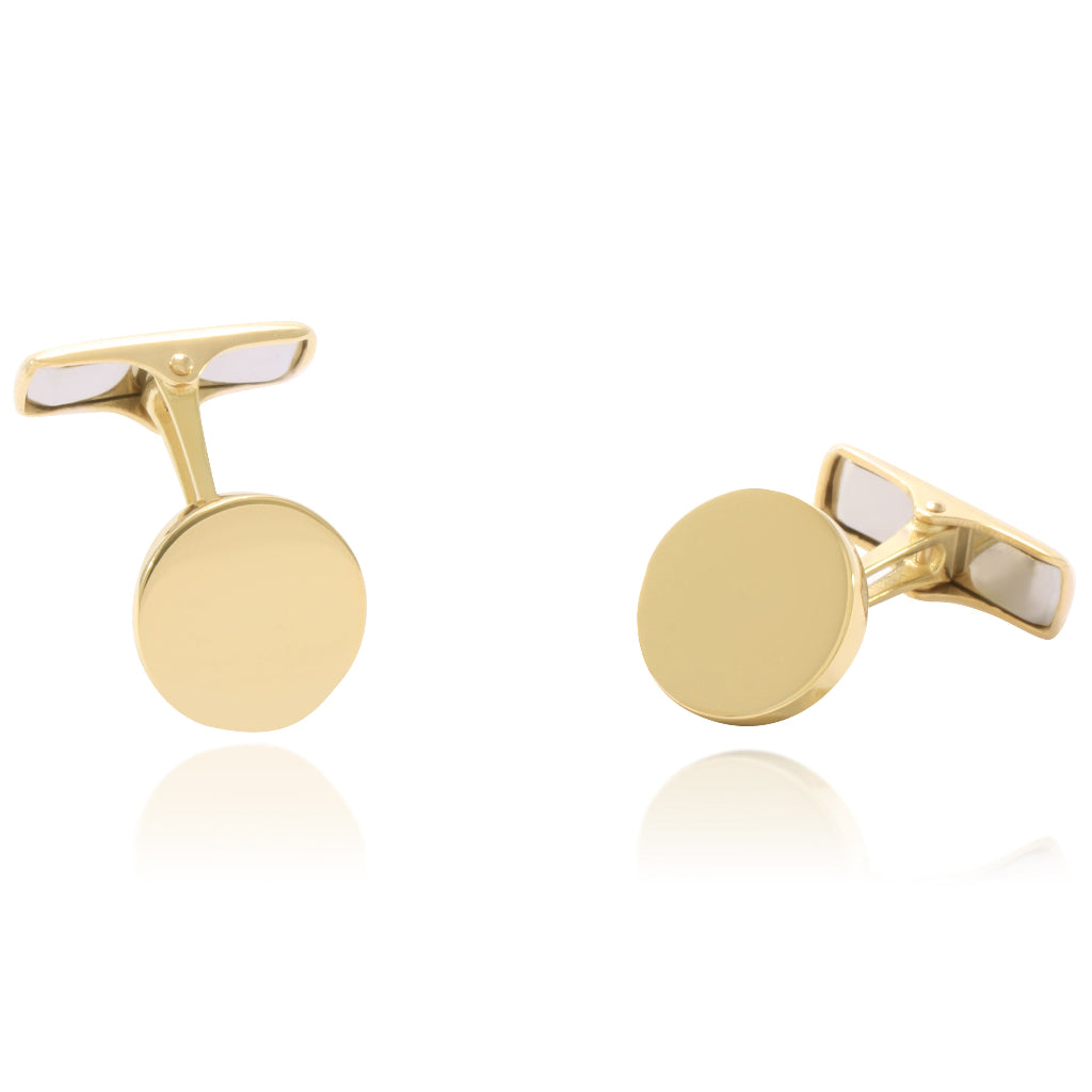 Gemelos para camisa planos circulares realizados en oro amarillo de 18 quilates.