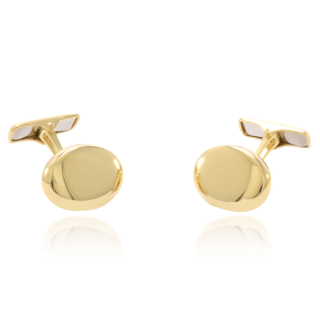 Gemelos para camisa ovalados realizados en oro amarillo de 18 quilates.