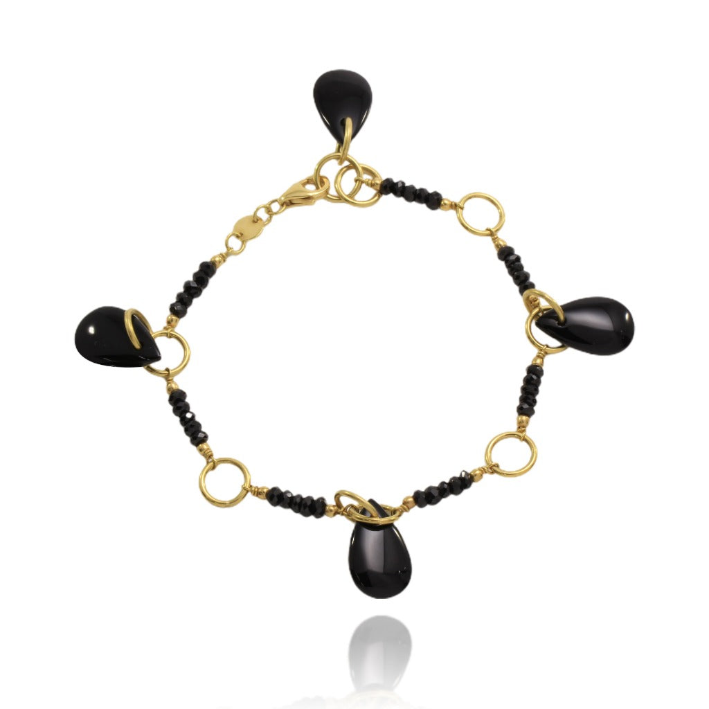 Pulsera de oro amarillo de 18 quilates y ónix. Joyería Pamplona. Pulsera negra