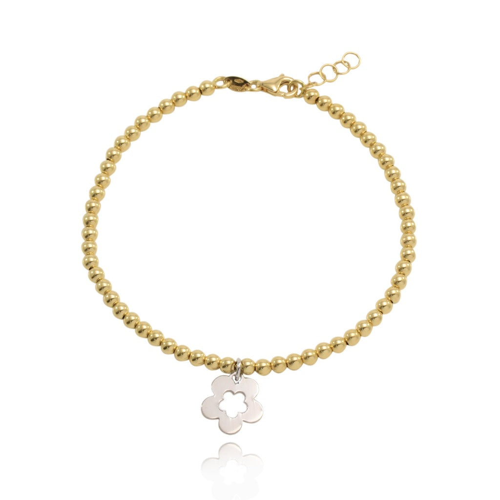 Pulsera flor de oro amarillo y blanco de 18 quilates. Joyería Pamplona.