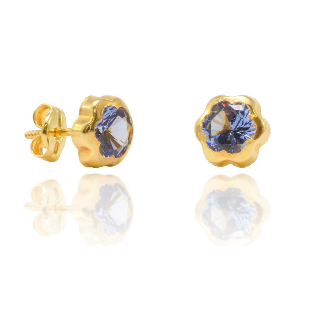 Pendientes en oro amarillo de 18 quilates, forma flor con circonita azul engarzada. Joyería Pamplona.