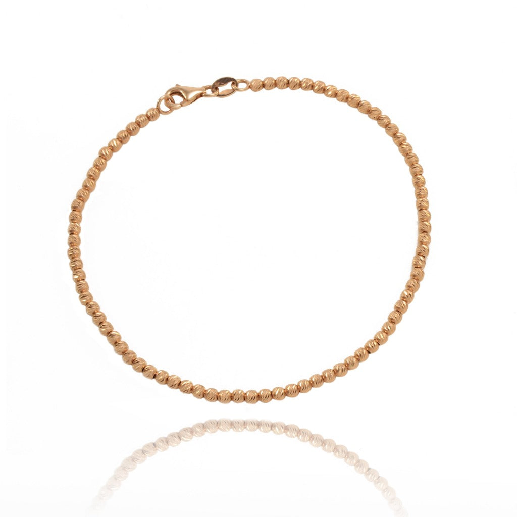 Pulsera de oro rosa de 18 quilates. Motivos de bola facetada. Tamaño 19,5 cm. Colección MONTREY, nuestra marca de la casa.