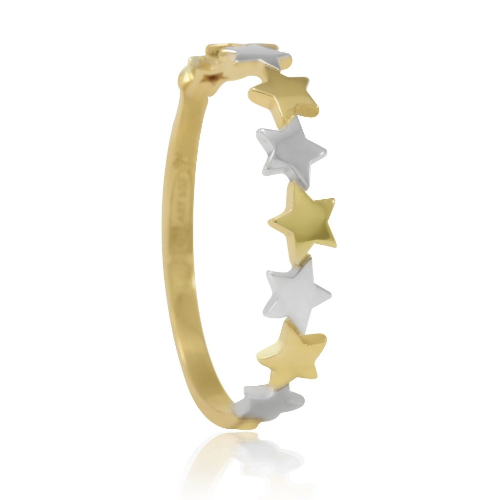 Sortija en oro amarillo y oro blanco de 18 quilates con motivos de estrella. Joyería Pamplona.