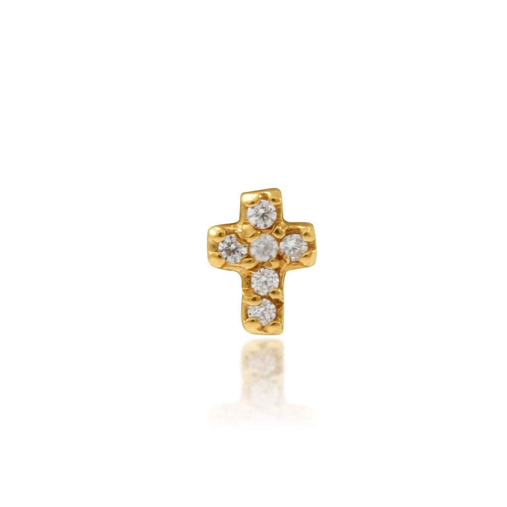 Piercing de oro amarillo de 18 quilates en forma de cruz con 6 circonitas engastadas. Colección MONTREY, la marca de la casa. 