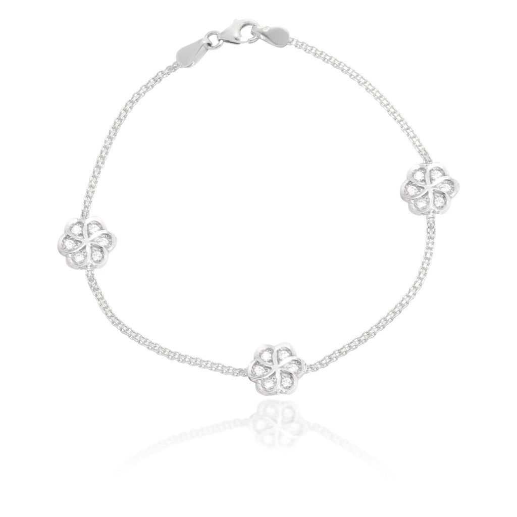 Pulsera realizada en oro blanco de 18 quilates con motivos de flores con circonitas.