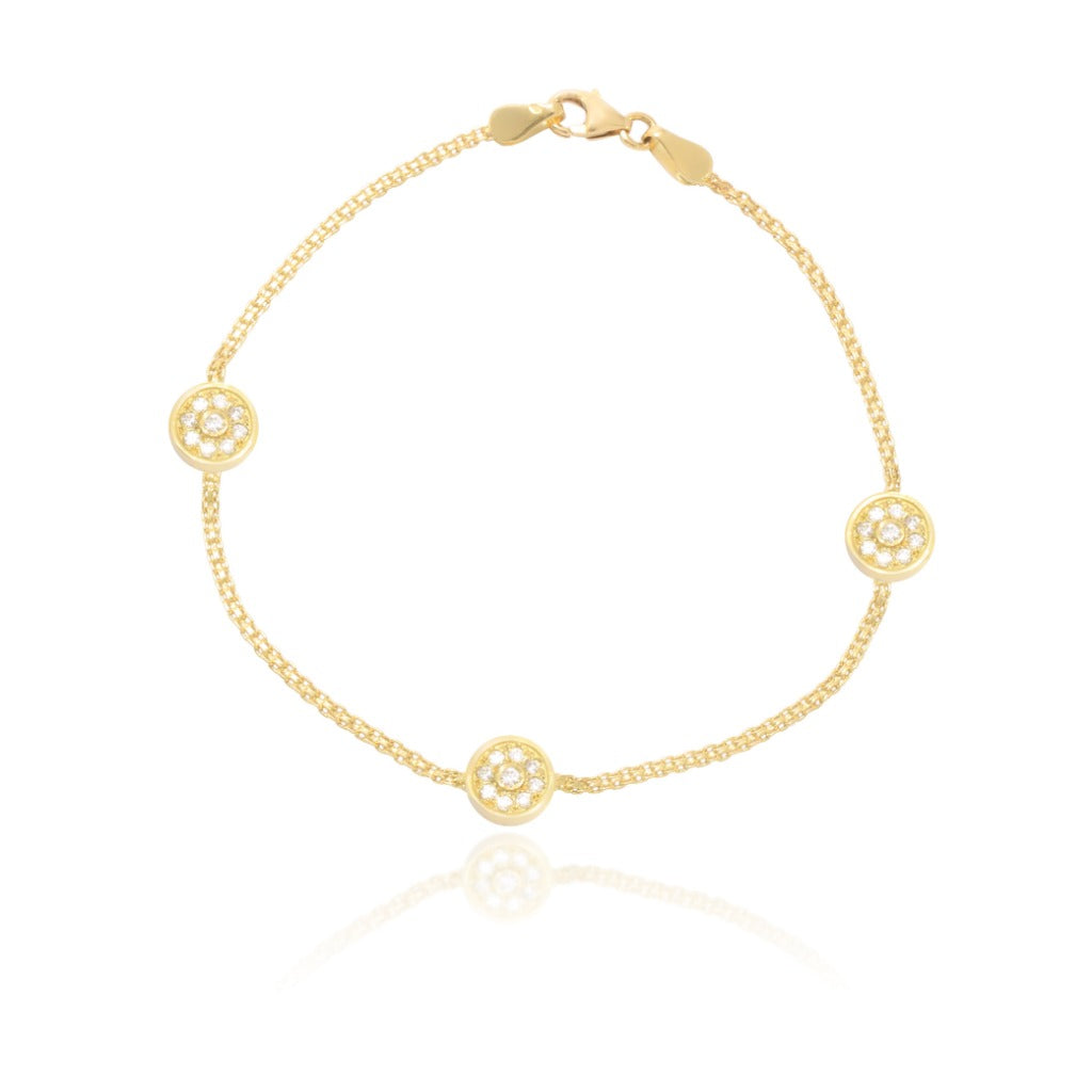 Pulsera realizada en oro amarillo de 18 quilates con motivos circulares con circonitas