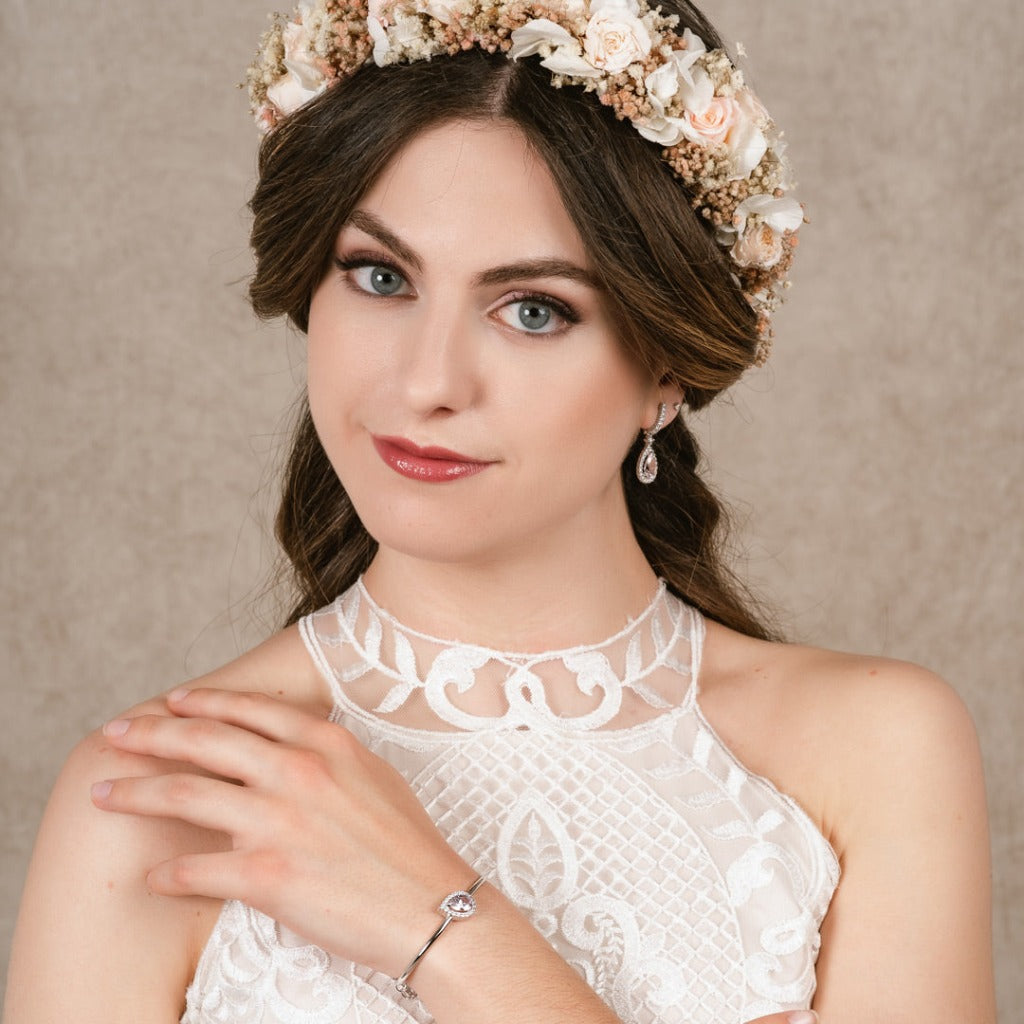 Pendientes de plata de primera ley (925) con baño de rodio con circonita blanca en forma de gota y piedra sintética central color rosa agua