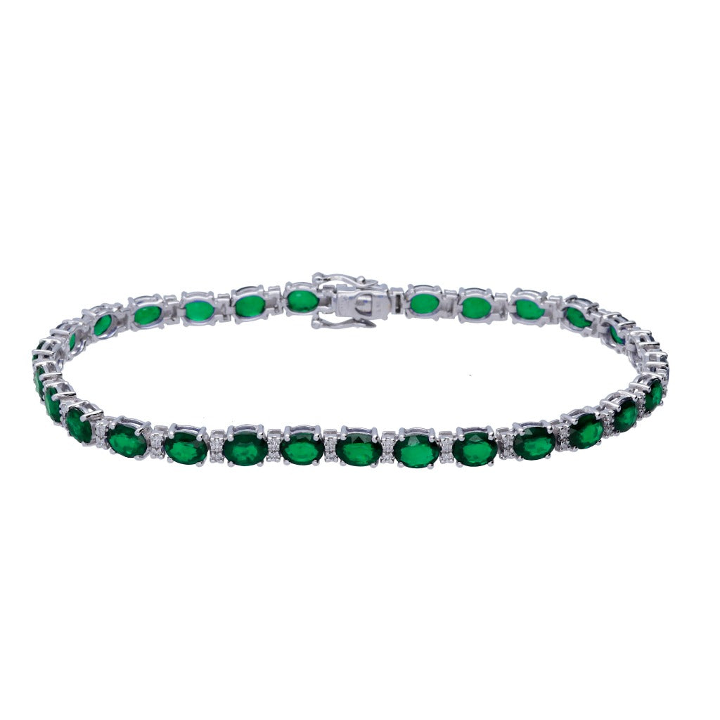 Pulsera riviere de oro blanco de 18 quilates con 28 esmeraldas y 58 diamantes alternados engastados en garras.